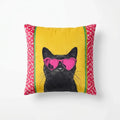 Pillow with a black cat wearing pink sunglasses on a yellow background