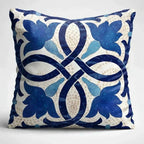 Decorative pillow with blue floral pattern on a white background