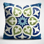 Decorative pillow with a blue and green pattern on a white background